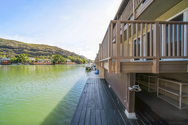 dock area featuring a water and mountain view