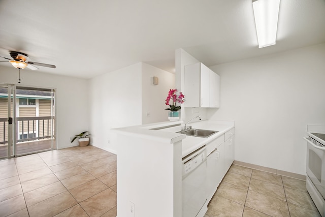 kitchen with sink, white appliances, light tile patterned floors, white cabinetry, and kitchen peninsula