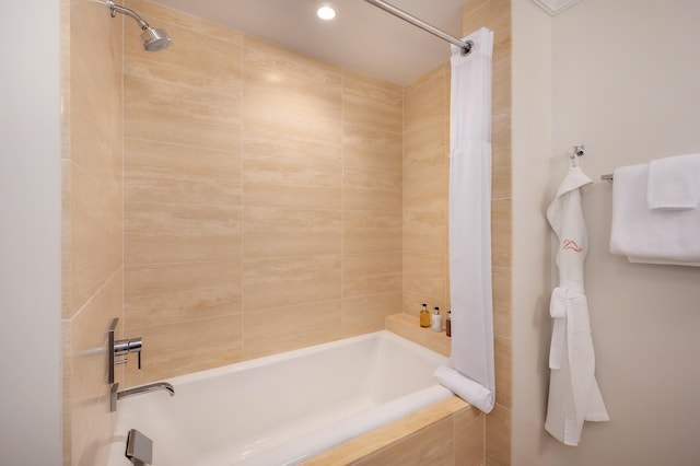 bathroom with shower / bath combination with curtain