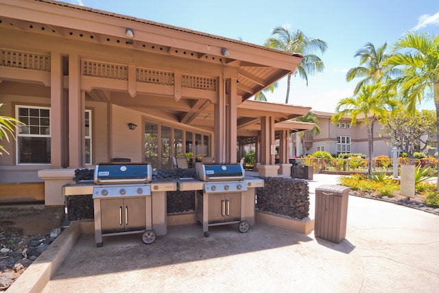 view of patio with grilling area and an outdoor kitchen