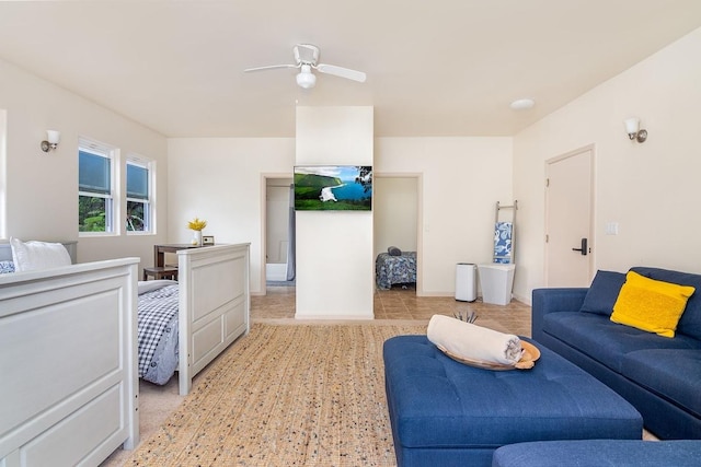 tiled living room featuring ceiling fan