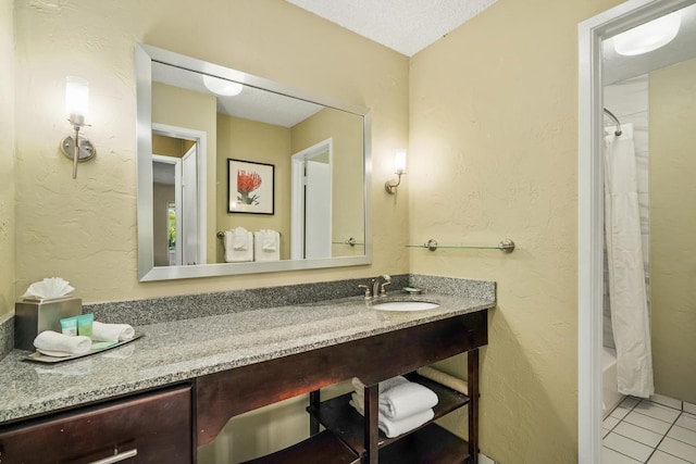 bathroom with tile patterned flooring, shower / tub combo, and vanity