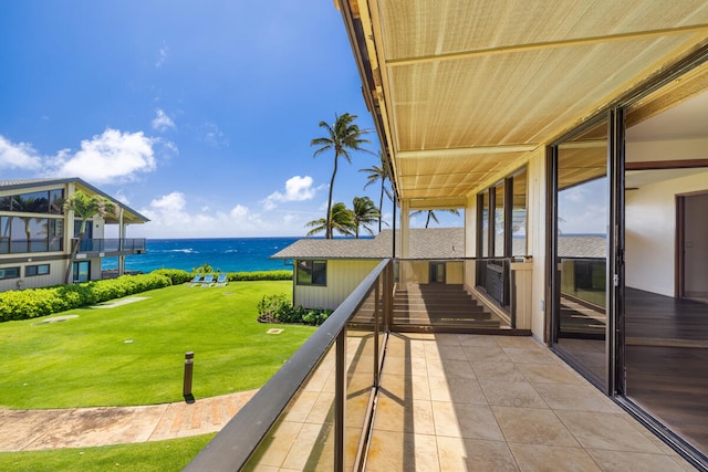 view of patio with a balcony and a water view