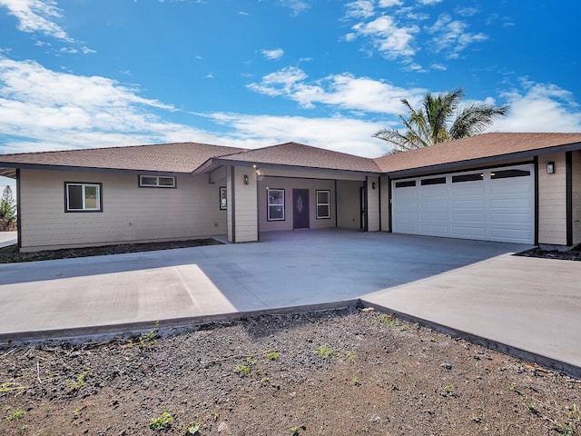 ranch-style house featuring a garage