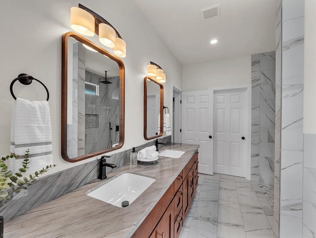 bathroom featuring walk in shower and vanity