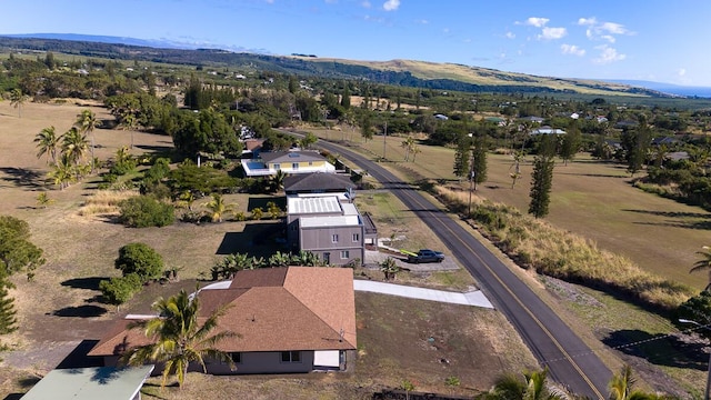 drone / aerial view featuring a mountain view