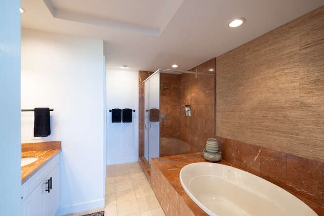 full bath with a stall shower, a garden tub, vanity, and recessed lighting