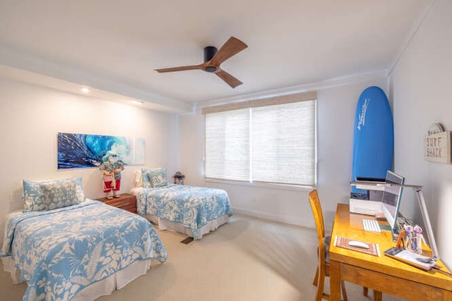 carpeted bedroom featuring a ceiling fan and baseboards