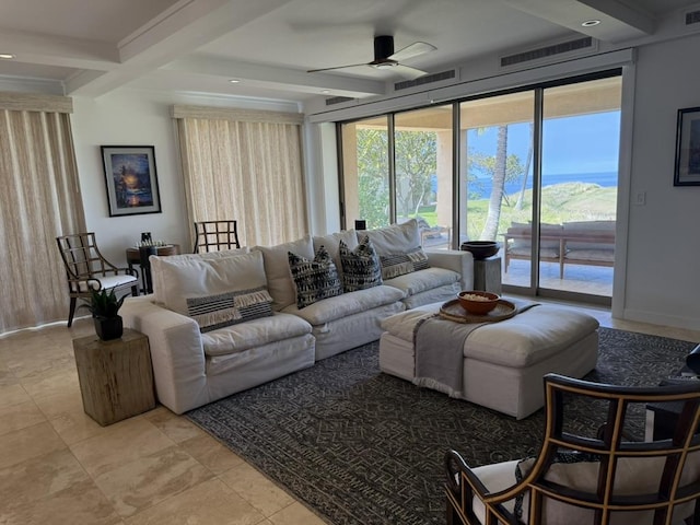 living room with a ceiling fan, baseboards, visible vents, and beamed ceiling