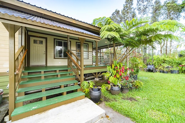 entrance to property with a yard