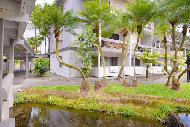 view of building exterior with a water view