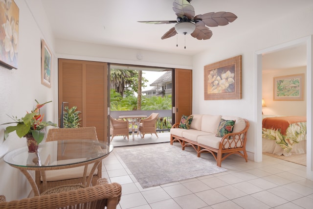 living room with ceiling fan and light tile patterned floors