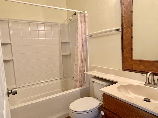 full bathroom with vanity, shower / tub combo, and toilet