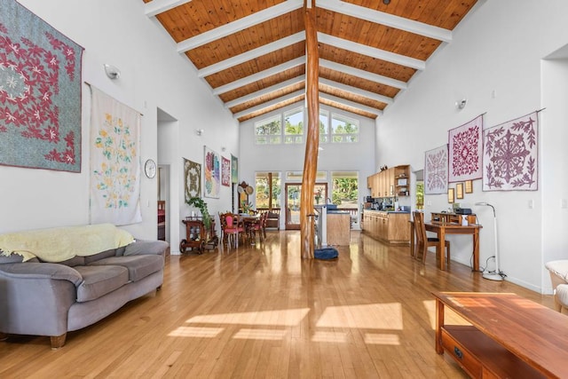 living room with beam ceiling, wood ceiling, and wood-type flooring