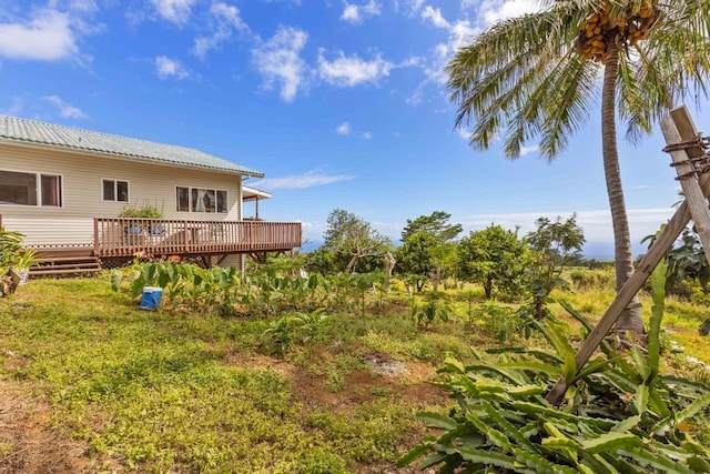 view of yard with a wooden deck