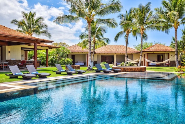 view of swimming pool with a patio area and a lawn