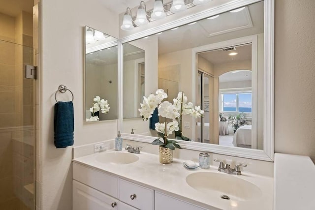 bathroom with vanity and an enclosed shower