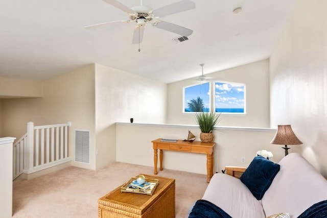 living room with lofted ceiling and light colored carpet