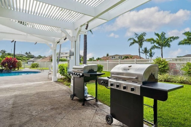 view of patio / terrace with a fenced in pool, a grill, and a pergola