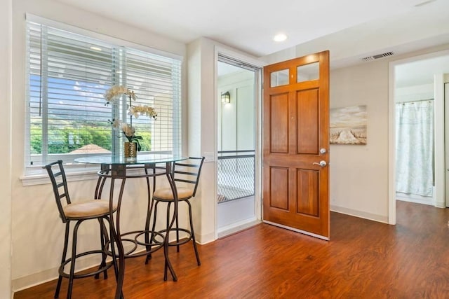 dining area featuring dark hardwood / wood-style floors