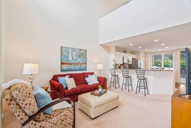 living room with light colored carpet