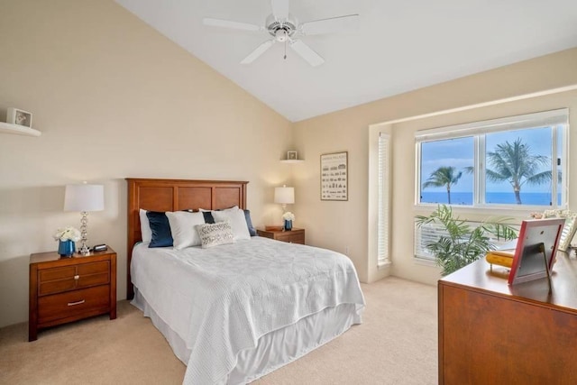 bedroom featuring lofted ceiling, light colored carpet, and ceiling fan