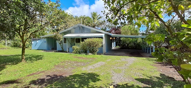 exterior space with a yard and a carport