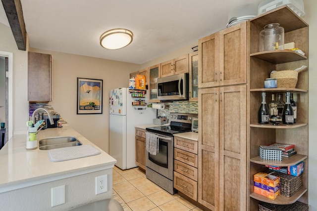 kitchen featuring sink, light tile patterned floors, appliances with stainless steel finishes, decorative backsplash, and light brown cabinets