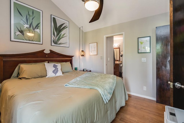 bedroom featuring lofted ceiling, connected bathroom, ceiling fan, and light hardwood / wood-style flooring