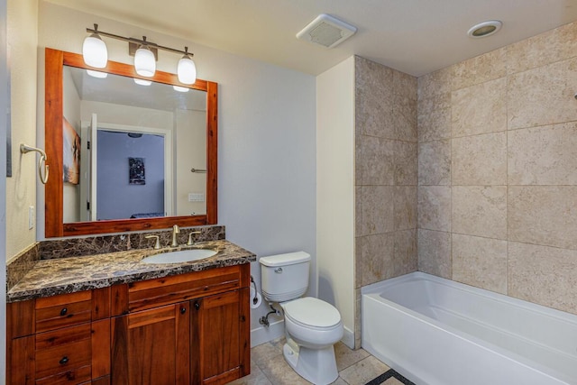 bathroom with tile patterned floors, vanity, and toilet