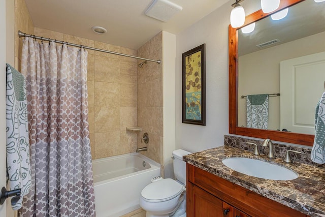 full bathroom with shower / tub combo with curtain, vanity, and toilet