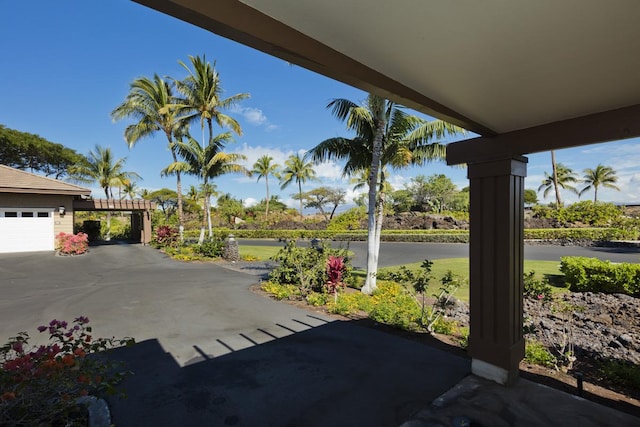 view of patio / terrace featuring a garage