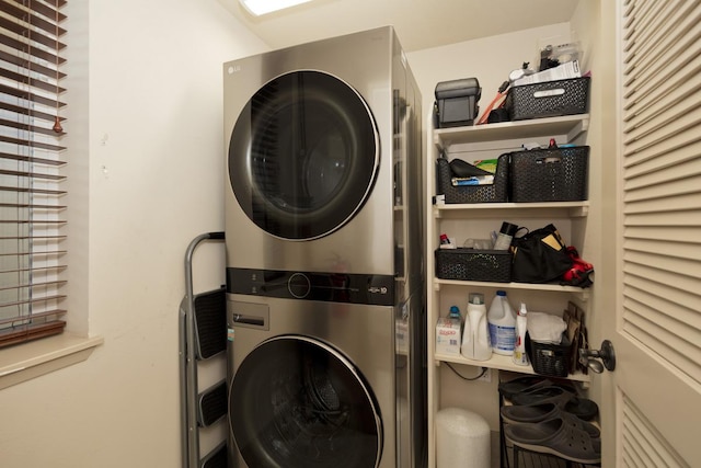 laundry area with stacked washer / drying machine