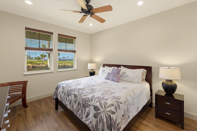 bedroom featuring dark hardwood / wood-style floors and ceiling fan