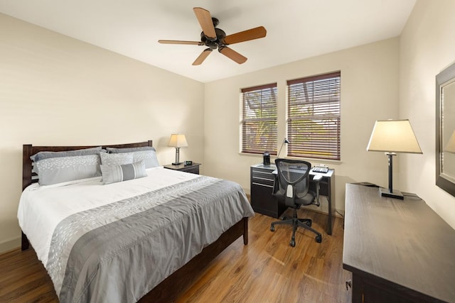 bedroom with ceiling fan and hardwood / wood-style floors