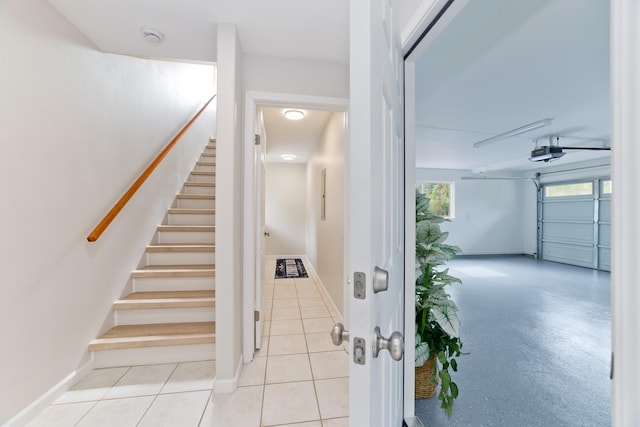 staircase featuring tile patterned floors