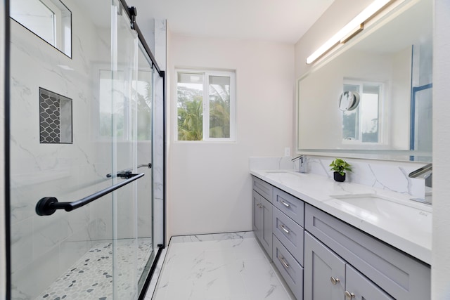 bathroom with vanity and a shower with shower door