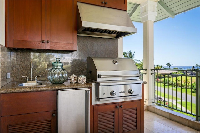 view of patio / terrace featuring an outdoor kitchen, a grill, and sink