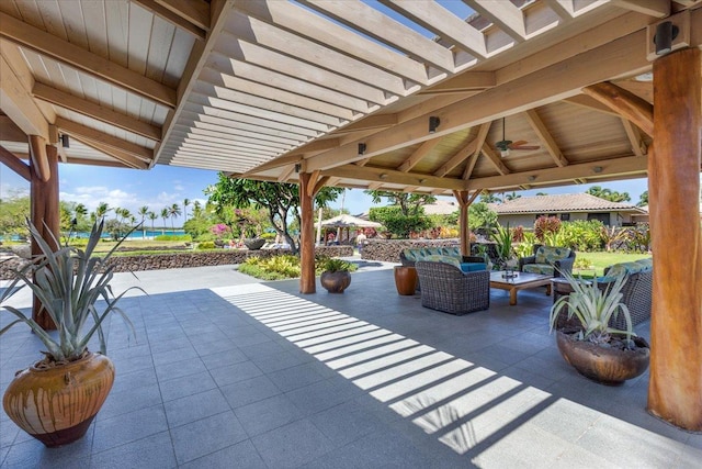 view of patio / terrace with a gazebo, ceiling fan, and an outdoor hangout area