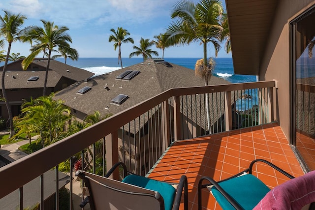 balcony featuring a water view