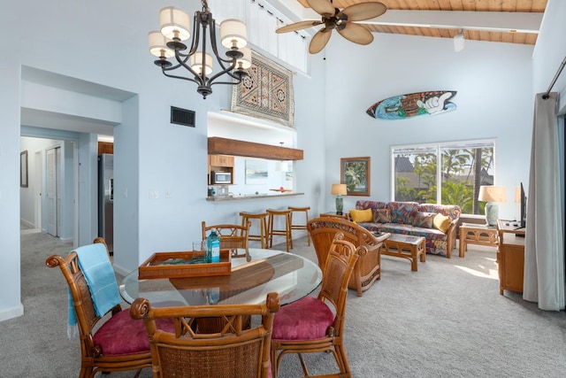 dining space featuring ceiling fan with notable chandelier, wooden ceiling, carpet flooring, and visible vents