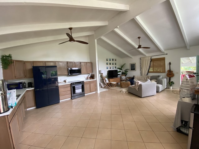 kitchen featuring stainless steel appliances, light tile patterned flooring, ceiling fan, and beam ceiling