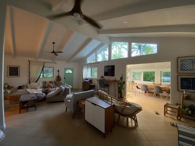 living room with beamed ceiling, high vaulted ceiling, ceiling fan, and light tile patterned flooring