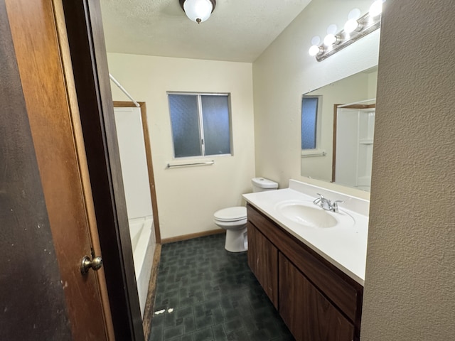 bathroom featuring toilet, tub / shower combination, vanity, a textured ceiling, and baseboards