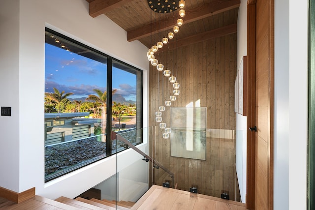 bathroom with lofted ceiling with beams, wood ceiling, and wood walls