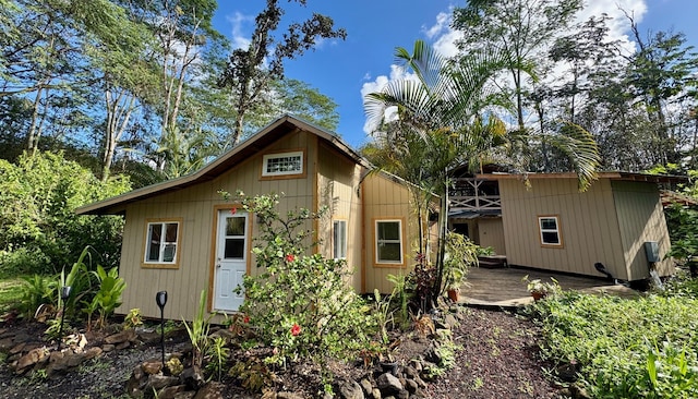 back of house with a wooden deck