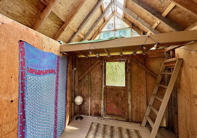 misc room featuring lofted ceiling and light wood finished floors