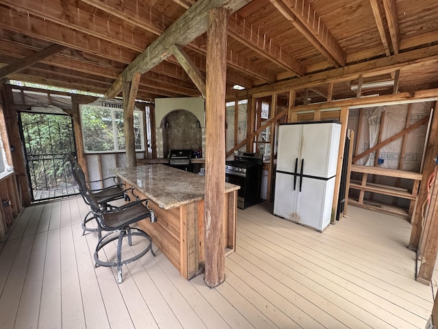 wooden deck featuring grilling area and outdoor dry bar