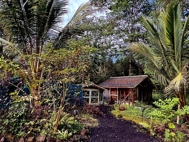 view of front of house with an outbuilding