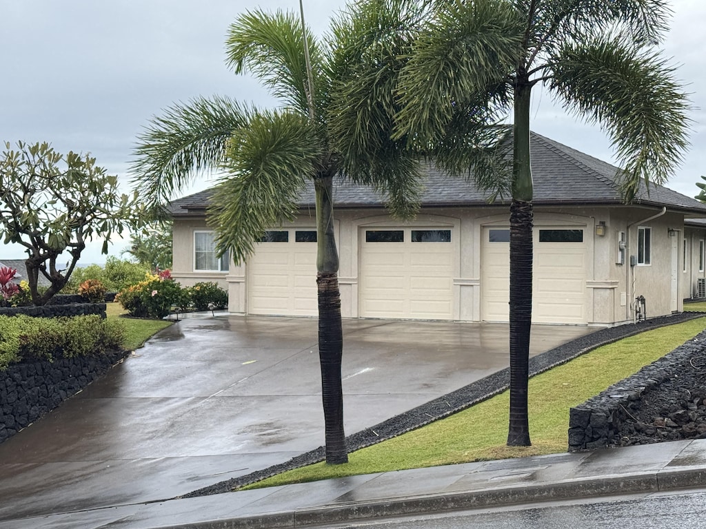 view of side of property featuring a garage